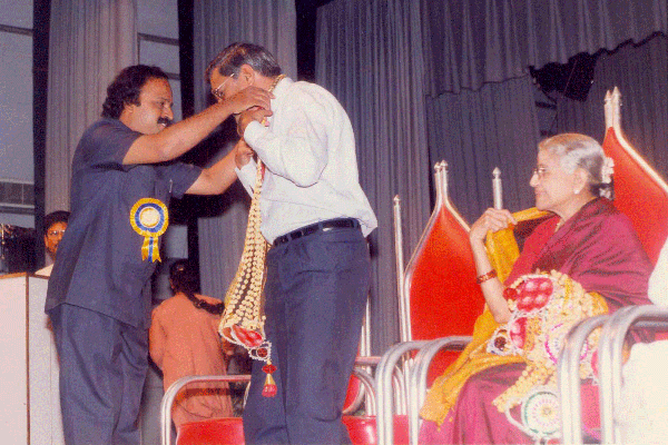 Mudhra Bhaskar honouring Mr.Suresh Krishna