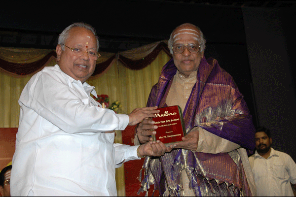 Sri.P.S.Narayanaswamy who feliciated the awardee Dr.Nedanuri being honoured by the president