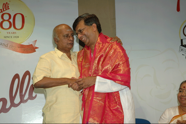 Radhu congratulating Y.G.M with a shawl