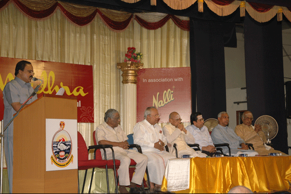 Mudhra Bhaskar delivers the secretary's report